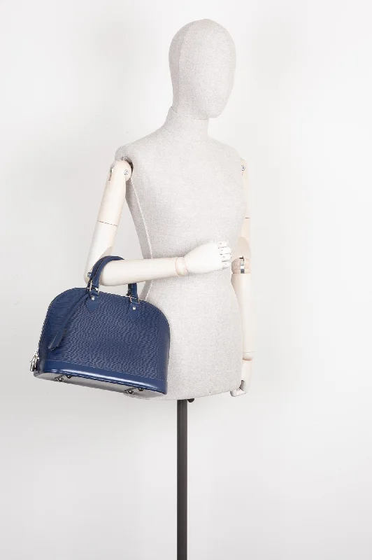 Louis Vuitton bags with a chain - link trim and a leather body for a modern edgeLOUIS VUITTON Alma PM Bag Epi Indigo