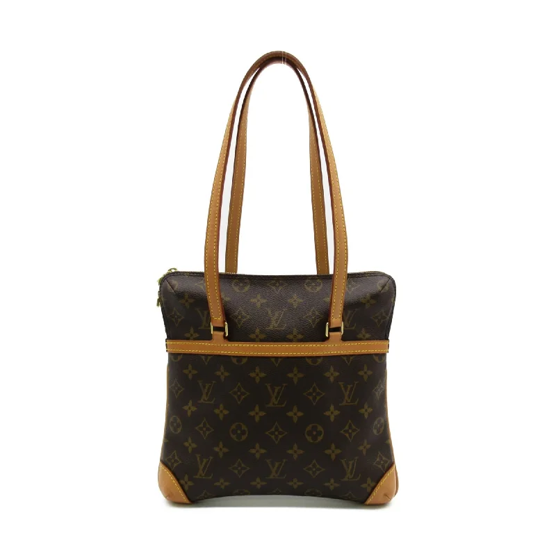 Louis Vuitton bags with a chain - link trim and a leather body for a modern edgeLOUIS VUITTON Kusan GM Brown Monogram PVC coated canvas M51141