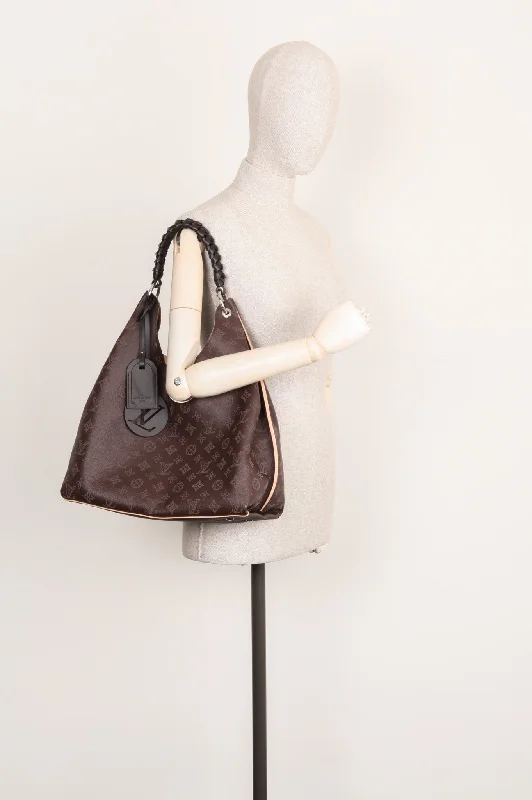 Louis Vuitton bags with a chain - link trim and a leather body for a modern edgeLOUIS VUITTON 2020 Carmel Mahina Bag Chocolate