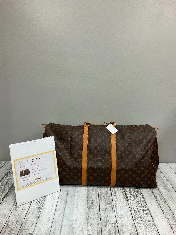 Louis Vuitton bags with a chain - link trim and a leather body for a modern edgeDuffle And Weekender Designer By Louis Vuitton  Size: Large