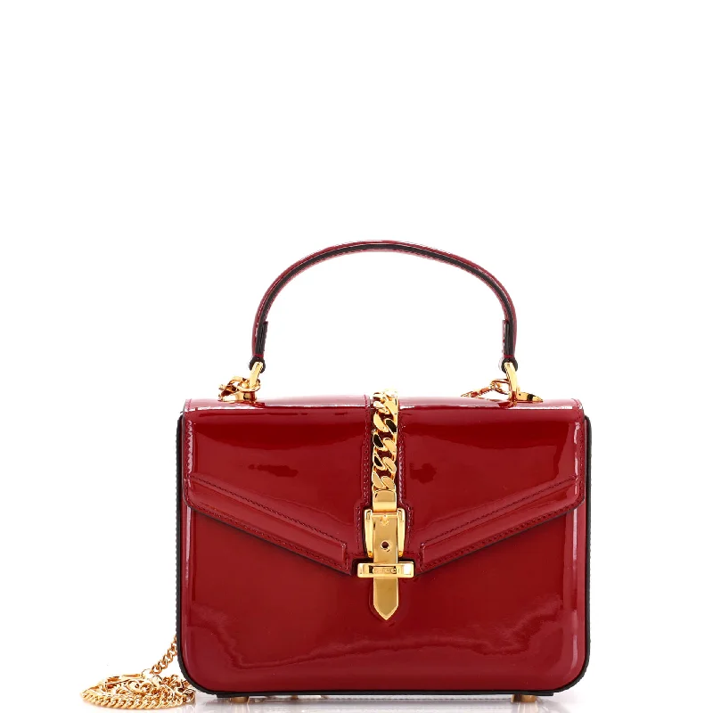 Christian Dior Saddle bags with a distressed leather finishSylvie 1969 Top Handle Bag Patent Mini