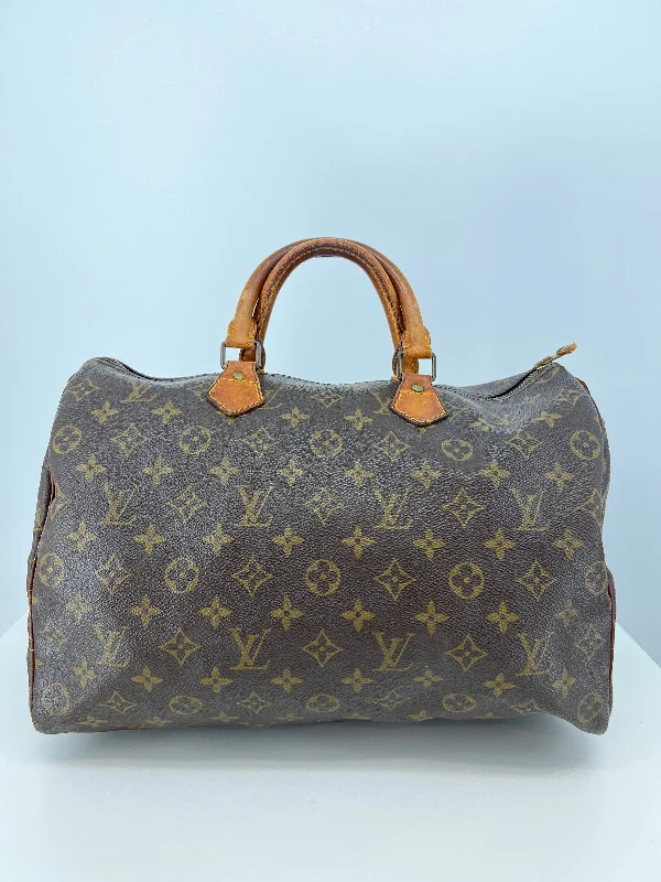 Louis Vuitton bags with a chain - link trim and a leather body for a modern edgeHandbag Luxury Designer By Louis Vuitton  Size: Medium