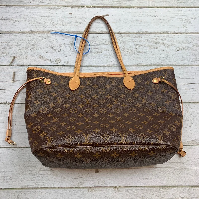 Louis Vuitton bags with a chain - link trim and a leather body for a modern edgeHandbag Luxury Designer By Louis Vuitton  Size: Large