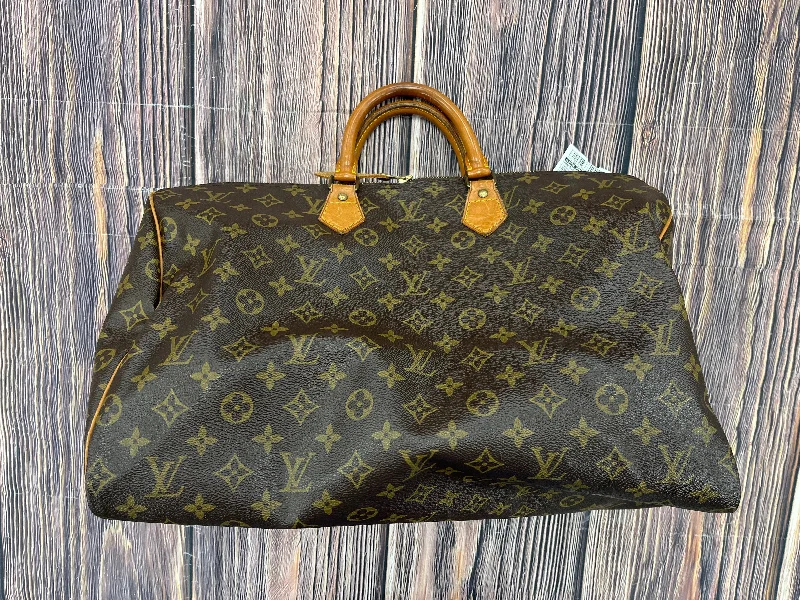 Louis Vuitton bags with a chain - link trim and a leather body for a modern edgeHandbag Luxury Designer By Louis Vuitton  Size: Large