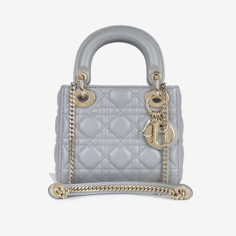 Christian Dior handbags with a snap - button closure and a decorative buckleMini Lady Dior