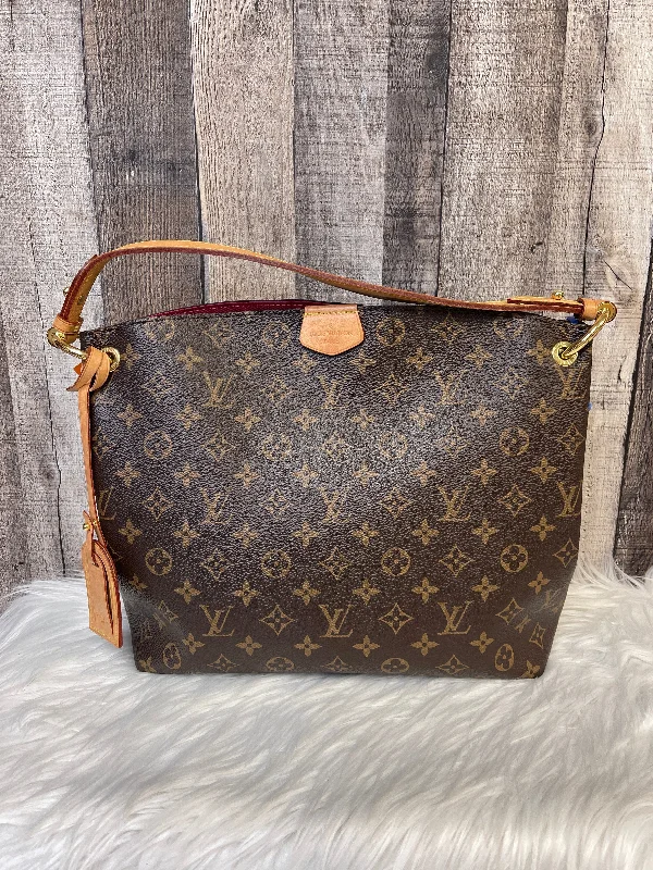 Louis Vuitton bags with a chain - link trim and a leather body for a modern edgeHandbag Luxury Designer By Louis Vuitton  Size: Large