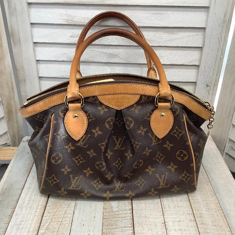 Louis Vuitton bags with a chain - link trim and a leather body for a modern edgeHandbag By Louis Vuitton  Size: Medium