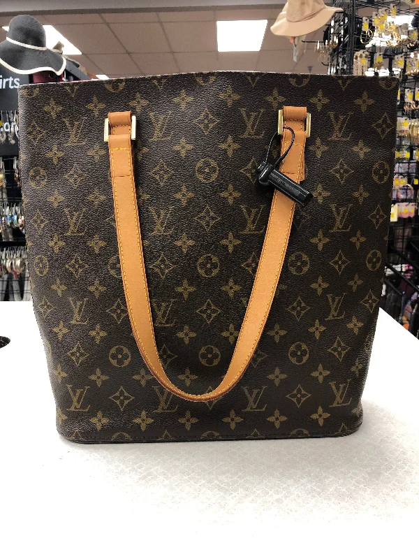 Louis Vuitton bags with a chain - link trim and a leather body for a modern edgeHandbag Luxury Designer By Louis Vuitton  Size: Large