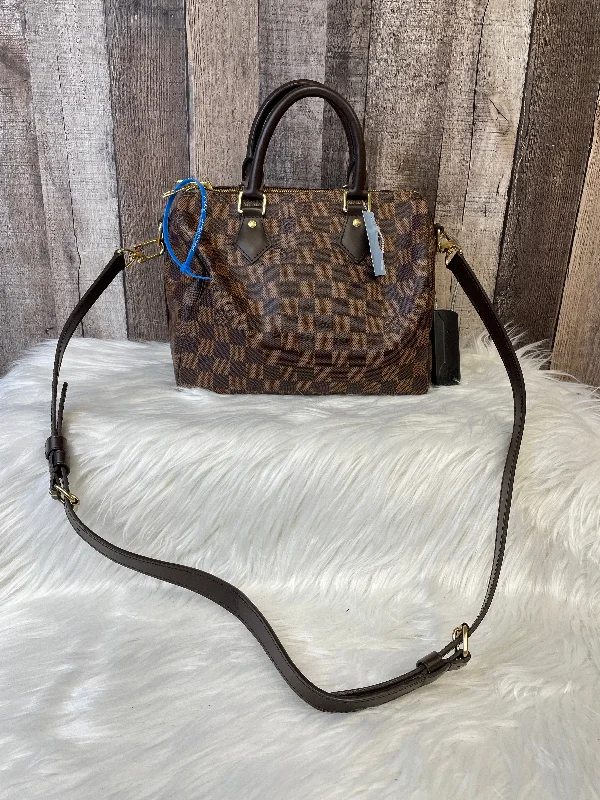 Louis Vuitton bags with a chain - link trim and a leather body for a modern edgeHandbag Designer By Louis Vuitton  Size: Medium